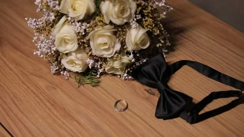 Image from the wedding day, man bow tie and wedding ring, together with a bouque Video stock 204001838