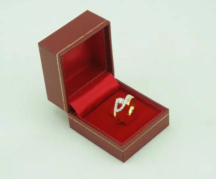 Image of wedding ring in a gift box Stock Photos