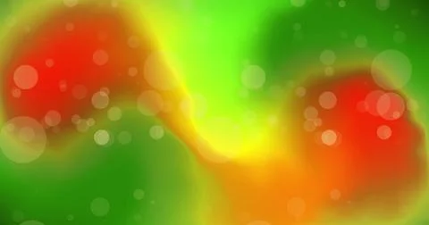 Image of white light orbs over green and orange lights Stock Photos