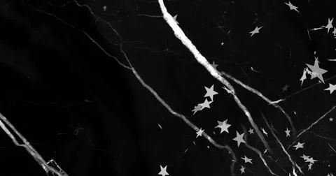 Image of white lightning bolts with falling white stars in on black background Stock Photos