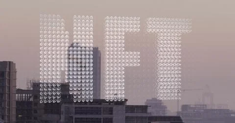 Image of white particles forming a nft text banner against aerial view of c.. Stock Photos