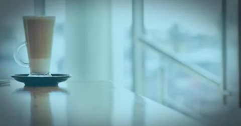 Image of a white QR code scanning over a cup of caffe latte standing Stock Photos