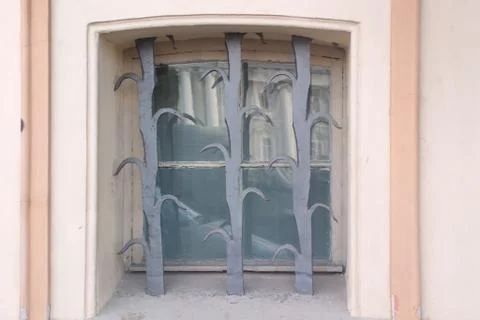 Image of a window in an old building with original protection Stock Photos