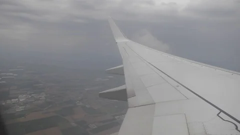 Image from a window of a plane in flight, sky and clouds Stockbeeldmateriaal 109549744