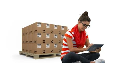 Image of woman using tablet with stacks of boxes on white background Stockfoto's