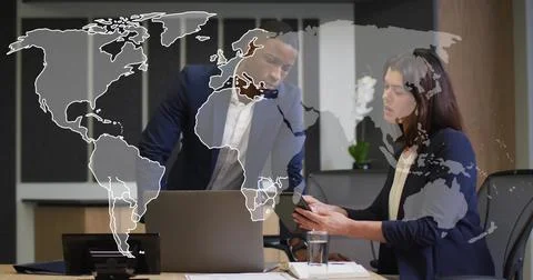 Image of world map and data processing over business people using laptop Foto stock