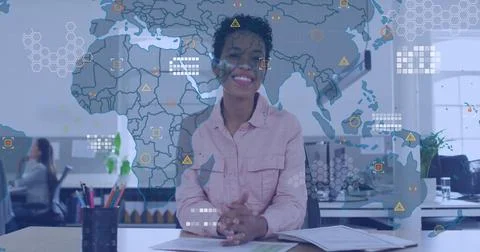 Image of world map over african american woman waving and smiling looking at Stock Photos