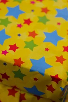 Image of a Wrapped Present with Star Paper Stock Photos