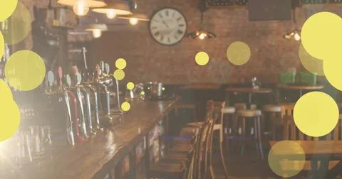 Image of yellow spots over bar interior Stock Photos