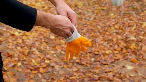 Image of yellow work gloves worn before work for Occupational Health and safety. Stock Footage 121372272