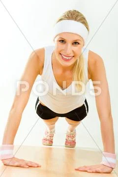 Image of young attractive woman doing physical exercise Stock Photos