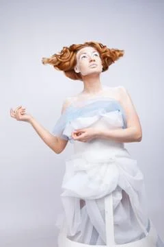 Image of a young beautiful red-haired woman. Young woman with an unusual Stock Photos
