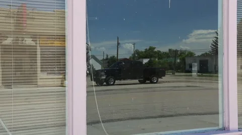 Image of Young Cowboy Reflected in Store Window Stock Footage 42379081