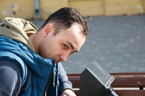 Image of young dark-haired man on a sunny day Foto stock