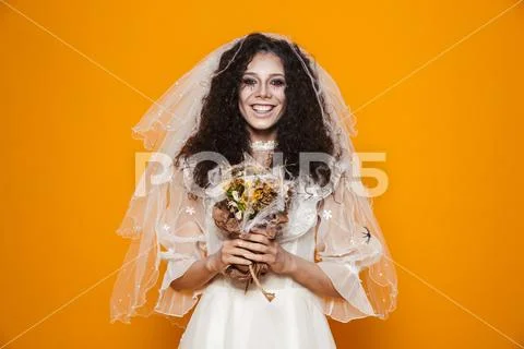 Image of young dead bride zombie on halloween wearing wedding dress and veil Stock Photos