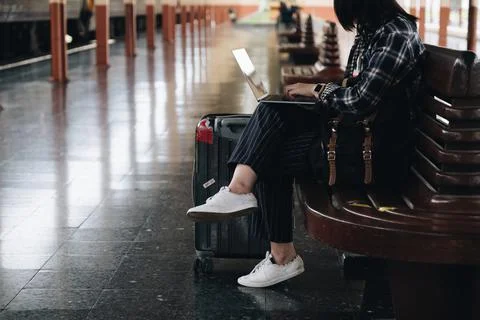 Image of Young freelance working at train station before travel. work and travel Stock Photos