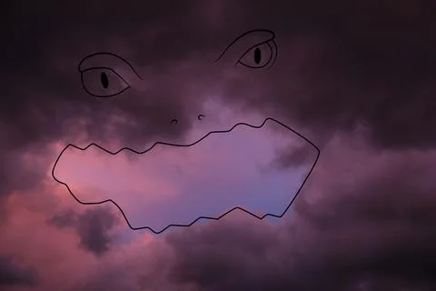 Imagination and creativity. Fluffy cloud resembling scary face in sky, draw.. Foto stock