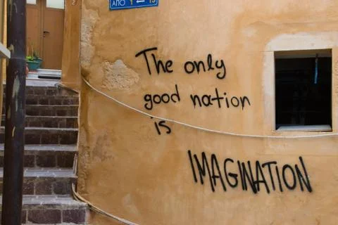 Imagination graffito on orange wall in old town Stock Photos