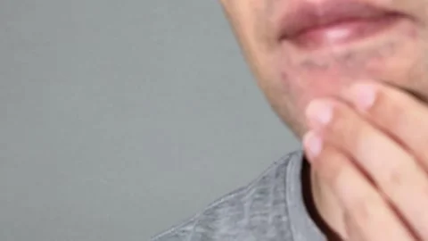 Imagine getting your beard removed for just one coin (a small amount of money). Video stock 336618196