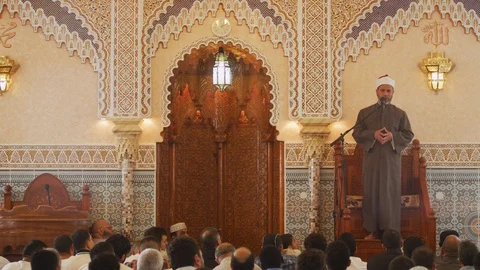Imam praying in front of Muslims Inside A Mosque - Islam friday prayer Video stock 102345257