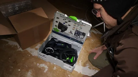 Ime-lapse fast motion of young male unboxing unpacking parcel box Festool Stock Footage 141625585