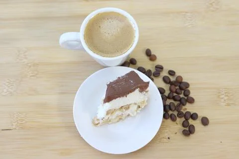 IMG 7611 Coffee and cake on wooden table background, top view. Stock Photos