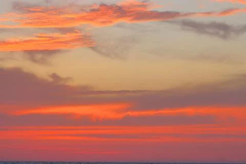 IMG 8387Cloudscape, Colored Clouds at Sunset near the Ocean on the Beach Stock Photos