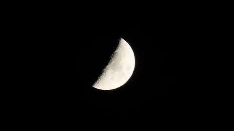 IMG 8451Half moon in the night sky. Close-up. Black background. 写真素材