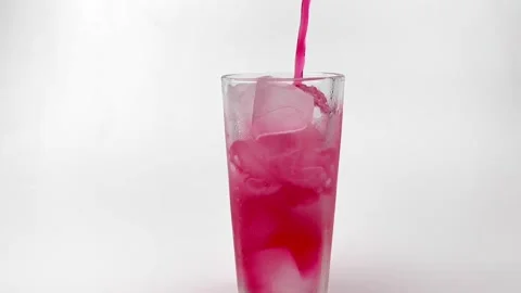 IMG Slow motion pouring soft Drinks, red soda with ice into Glass Isolated 3805 Stock Footage 171153219
