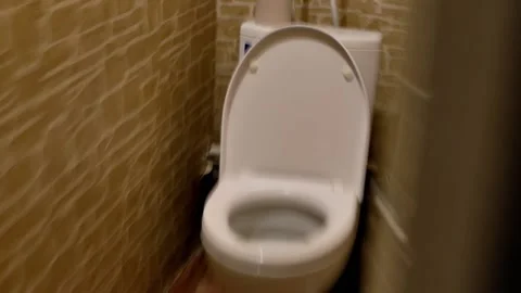 Imitation of a first-person view of a drunk person running to the toilet Stock Footage 219631259