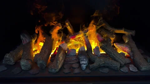 Imitation of a live fire in the fireplace with the help of an air humidifier. Stock Footage 163716578