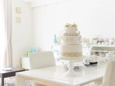 An imitation wedding cake coordinated with macaroons. Stock Photos