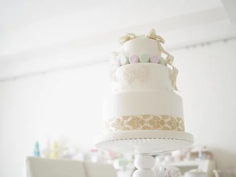 An imitation wedding cake coordinated with macaroons. Stock Photos