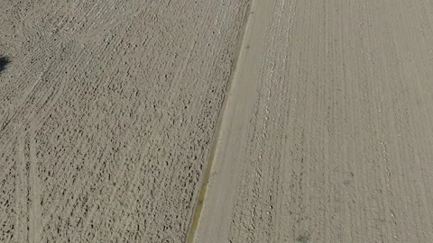 Immense Mud-covered Agricultural Fields after the Flood, Wide Shot Stock Footage 287484677