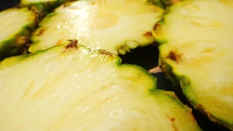 Immerse in a macro video of a pineapple slice Stock Footage 246594602