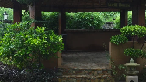 Immerse in tranquility of rain-soaked jungles with this Asian property, boasting Stock Footage 266886546