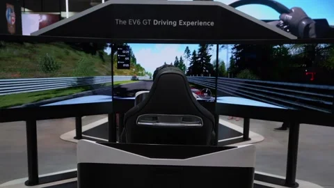 Immerse yourself in captivating, cuttingedge EV GT driving simulator experience Stock Footage 291631577