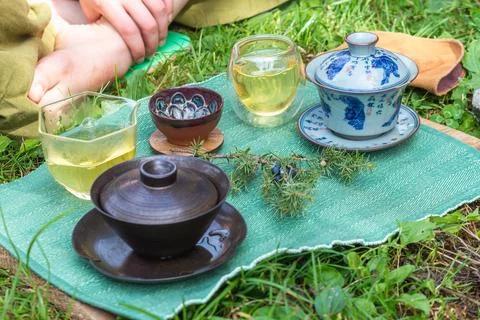 Immerse yourself in the elegance of a tea ceremony setting with clay bowls, a Stock Photos
