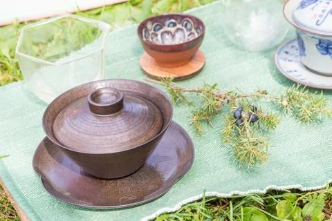 Immerse yourself in the elegance of a tea ceremony setting with clay bowls, a Stock Photos
