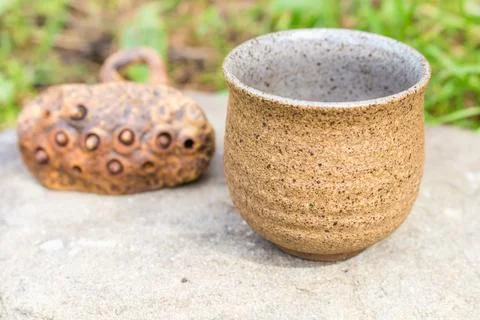 Immerse yourself in the elegance of a tea ceremony setting with clay bowls, a Stock Photos
