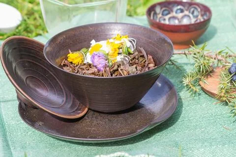 Immerse yourself in the elegance of a tea ceremony setting with clay bowls, a Stock-Fotos