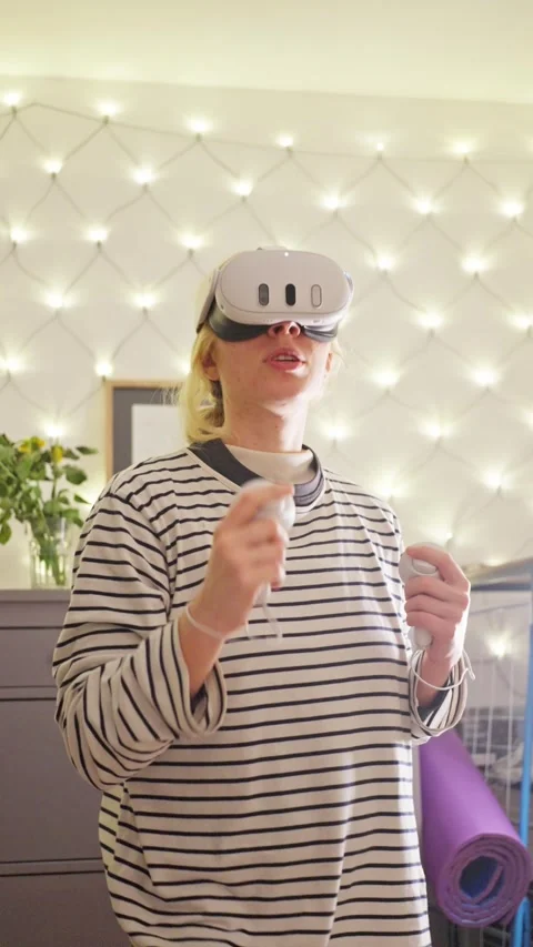 Immerse Yourself in an Engaging Virtual Reality Experience in a Cozy Room with Stock Footage 303488776