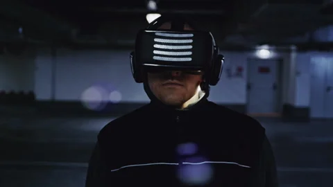 Immersed in VR: Man Walking and Looking Around in Digital Space Video stock 332539665