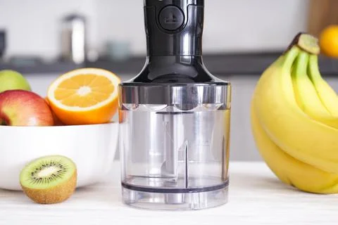 Immersion hand blender on table on a kitchen background, close-up. Electric h Foto stock