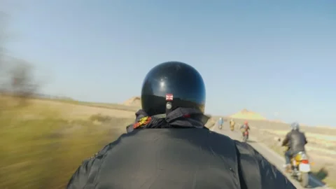 Immersion on a motorcycle accelerating on a desert road Stock Footage 194743018