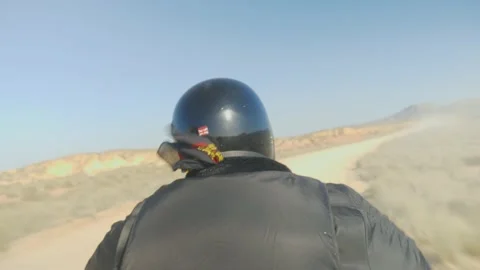 Immersion on a motorcycle accelerating on a desert road Stock Footage 194743791