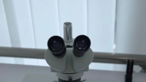 Immersion in a science microscope 動画素材 130980284