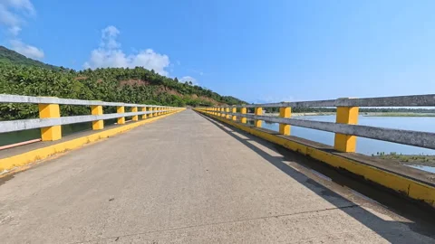 Immersive 4K Vertical POV Crossing a River Bridge toward Scenic Mountains Stock Footage 336752226