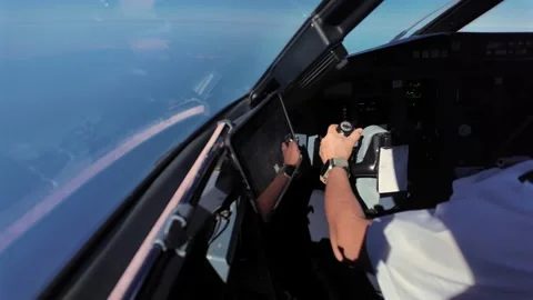 Immersive Cockpit View: Pilot’s Hand on the Flight Controls of a Jet Flying Stock Footage 341128828