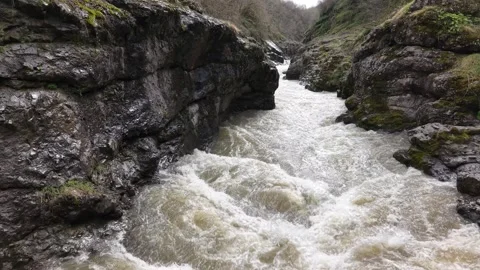 Immersive Falling Perspective Through Canyon River 4K Cinematic Shot Stock Footage 334429911